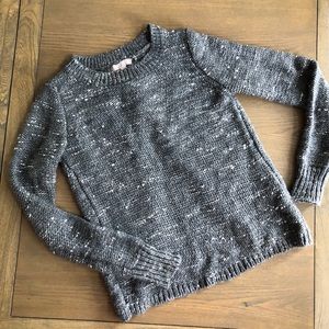 Shimmery silver and gray open back sweater